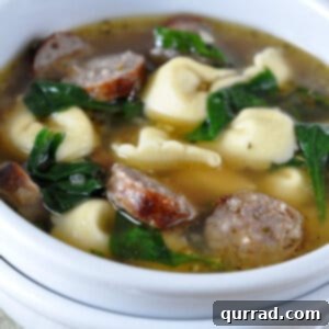 Close-up of a serving of Sausage Tortellini Soup