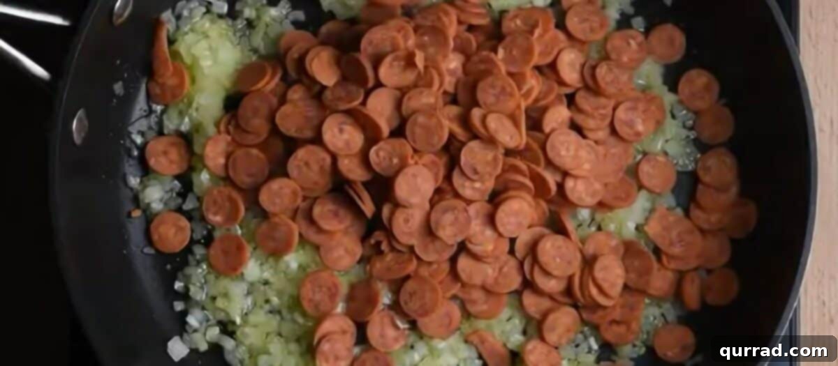 Pizzaroni Mac and Cheese 6 Diced sweet onions and mini pepperoni pieces sautéing in a large skillet with olive oil, ready for the next step.