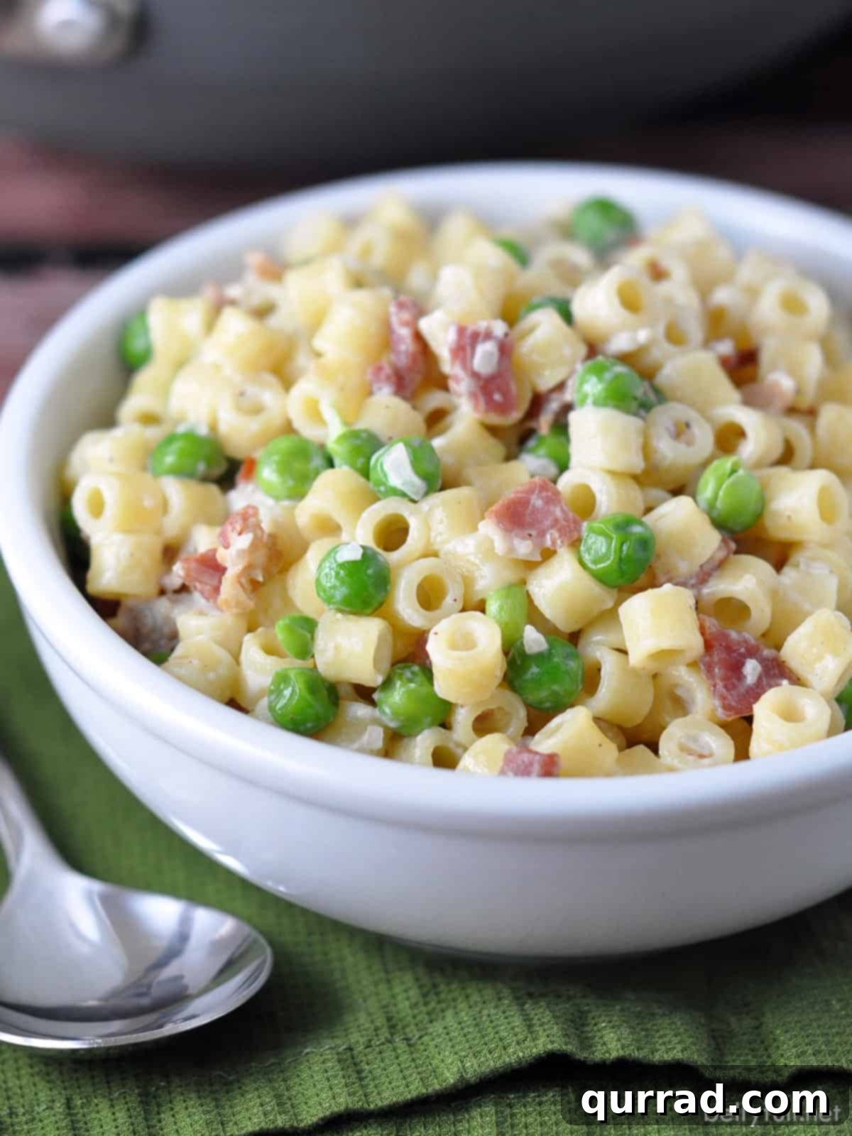 Silky Pasta with Smoked Bacon and Sweet Peas 4 Bacon and peas pasta in white bowl