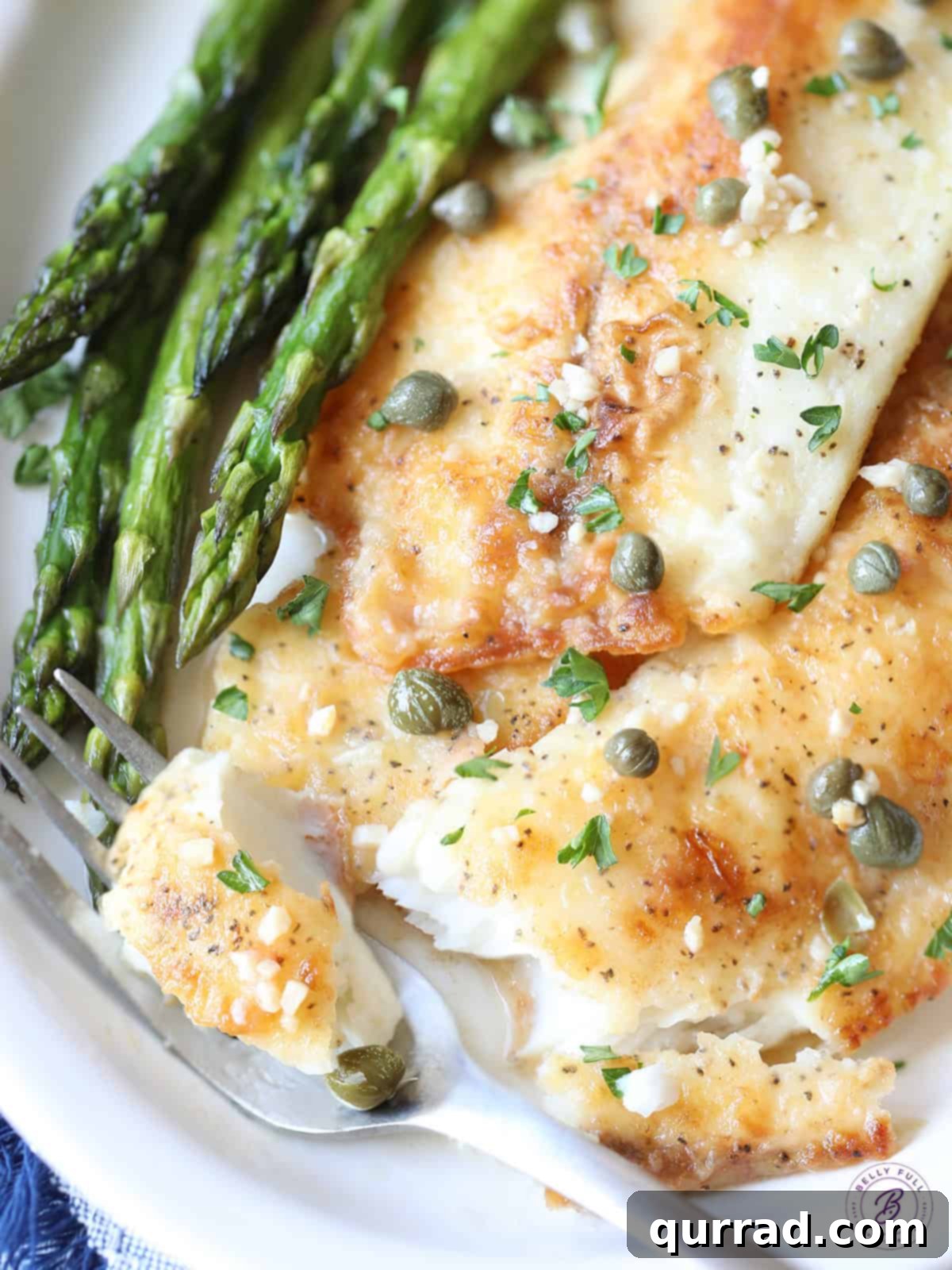 Zesty Lemon-Caper Fish 4 cooked flaked white fish on fork with capers