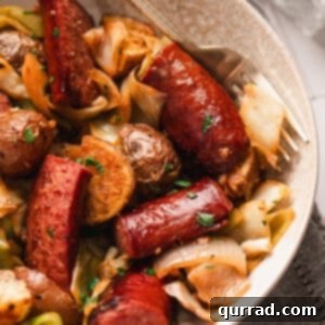 Skillet Kielbasa and Cabbage with potatoes in a serving bowl.