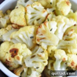 bowl full of golden roasted cauliflower florets