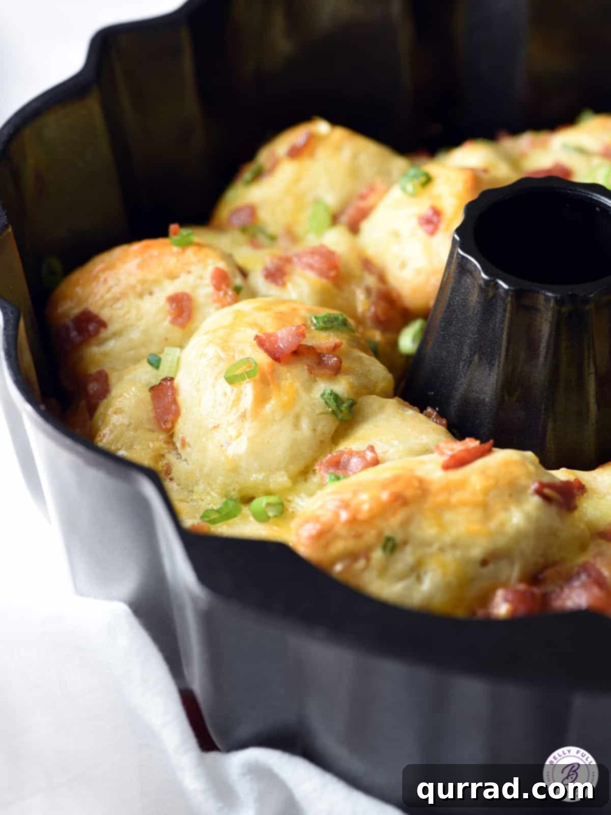 Tear & Share Breakfast Bread 2 pull apart bread in bundt pan with bacon and scallions
