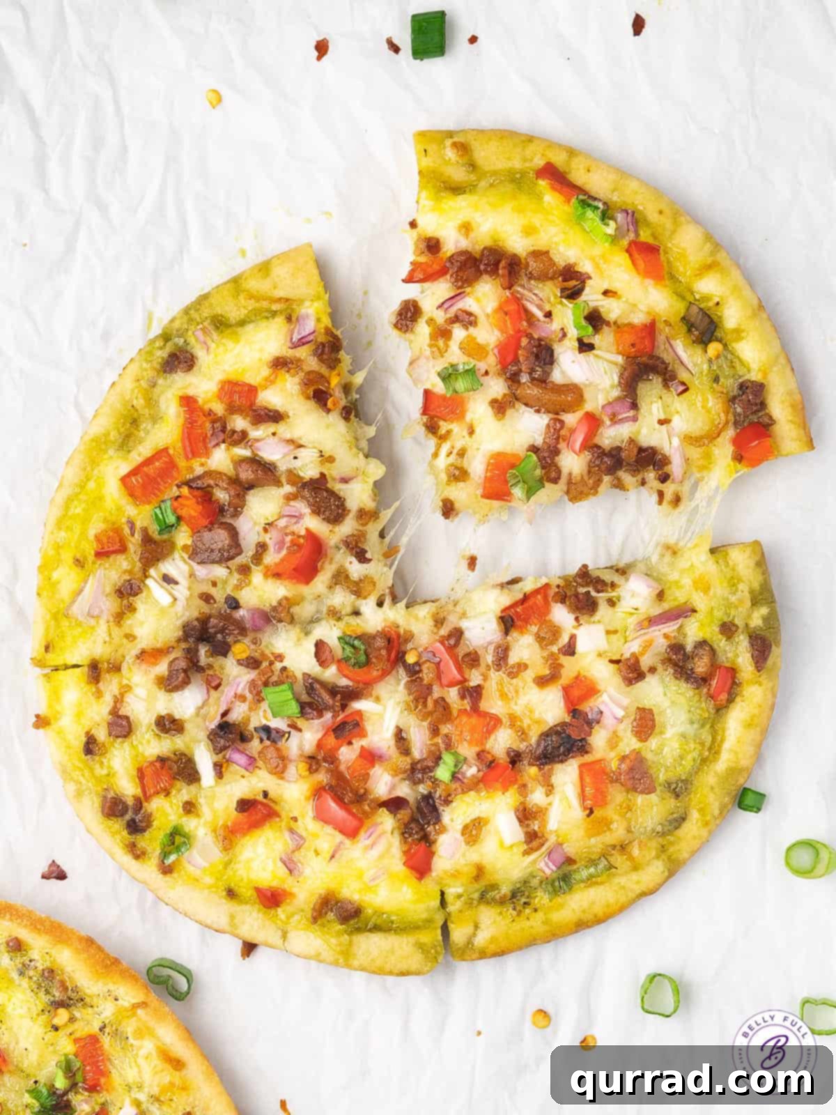 pita breakfast pizza sliced into 4 wedges
