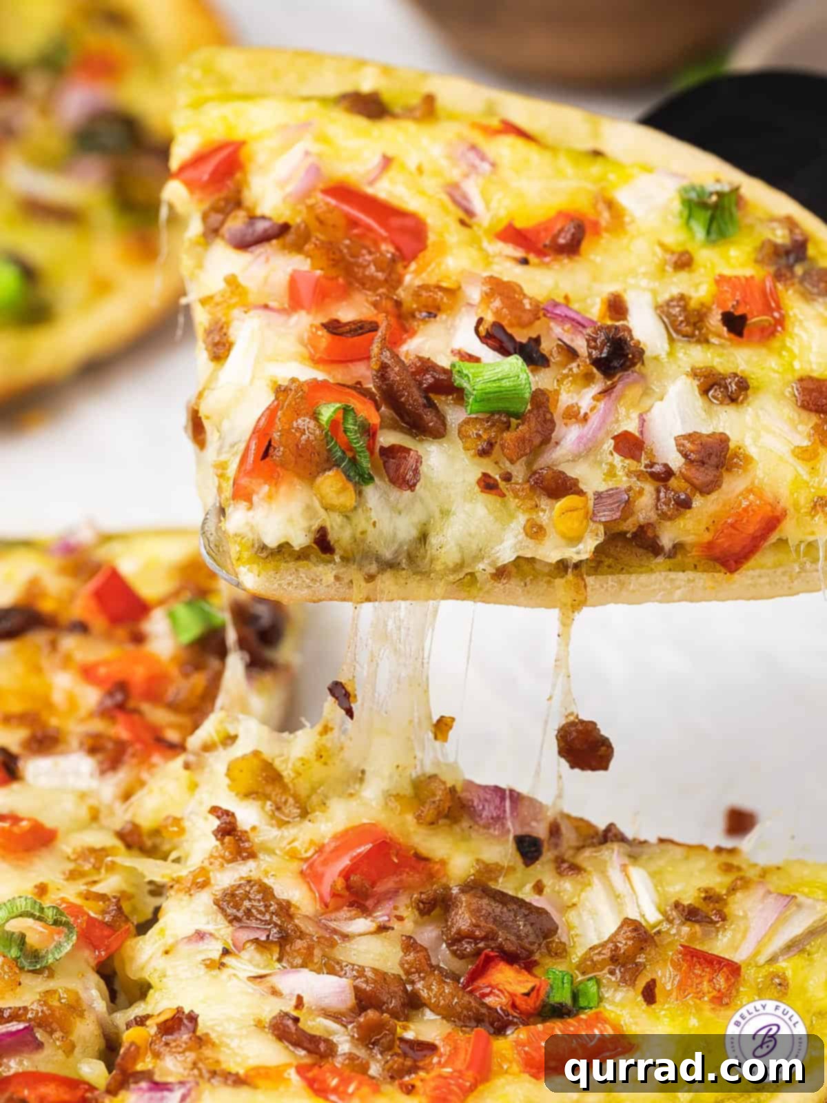 slice of pizza topped with bacon and veggies