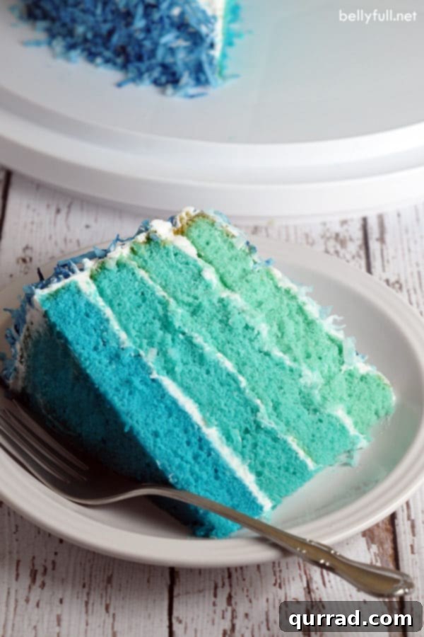 slice of blue ombre cake on white plate