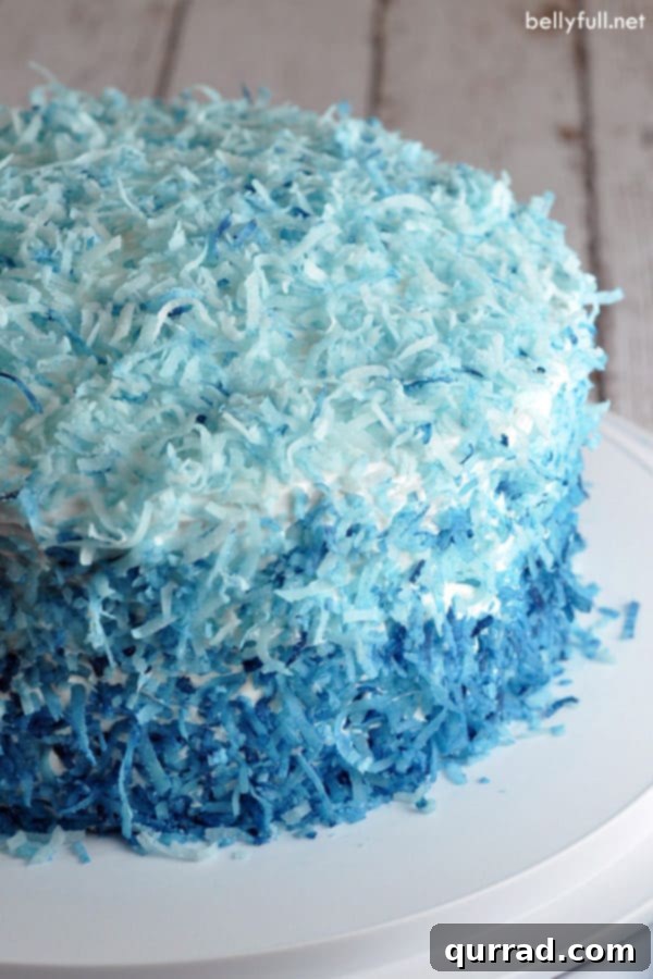 exterior of ombre cake decorated with shades of blue coconut