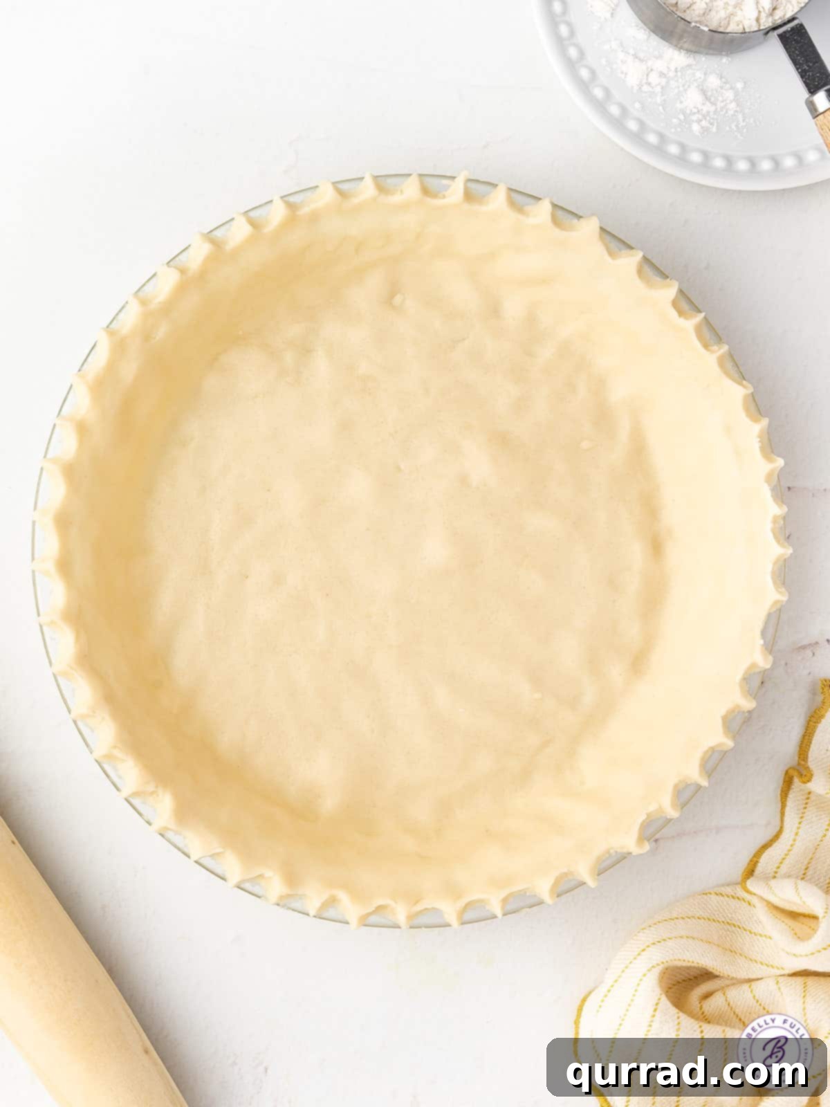 Perfect Homemade Pie Crust 2 overhead unbaked pie crust with crimped edges, ready for filling
