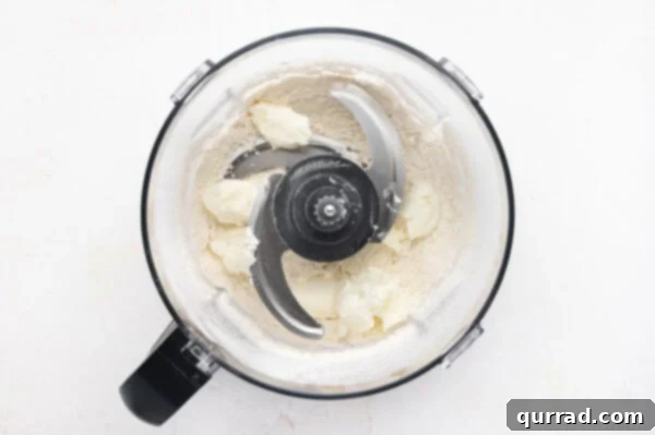 flour and vegetable shortening in bowl of food processor