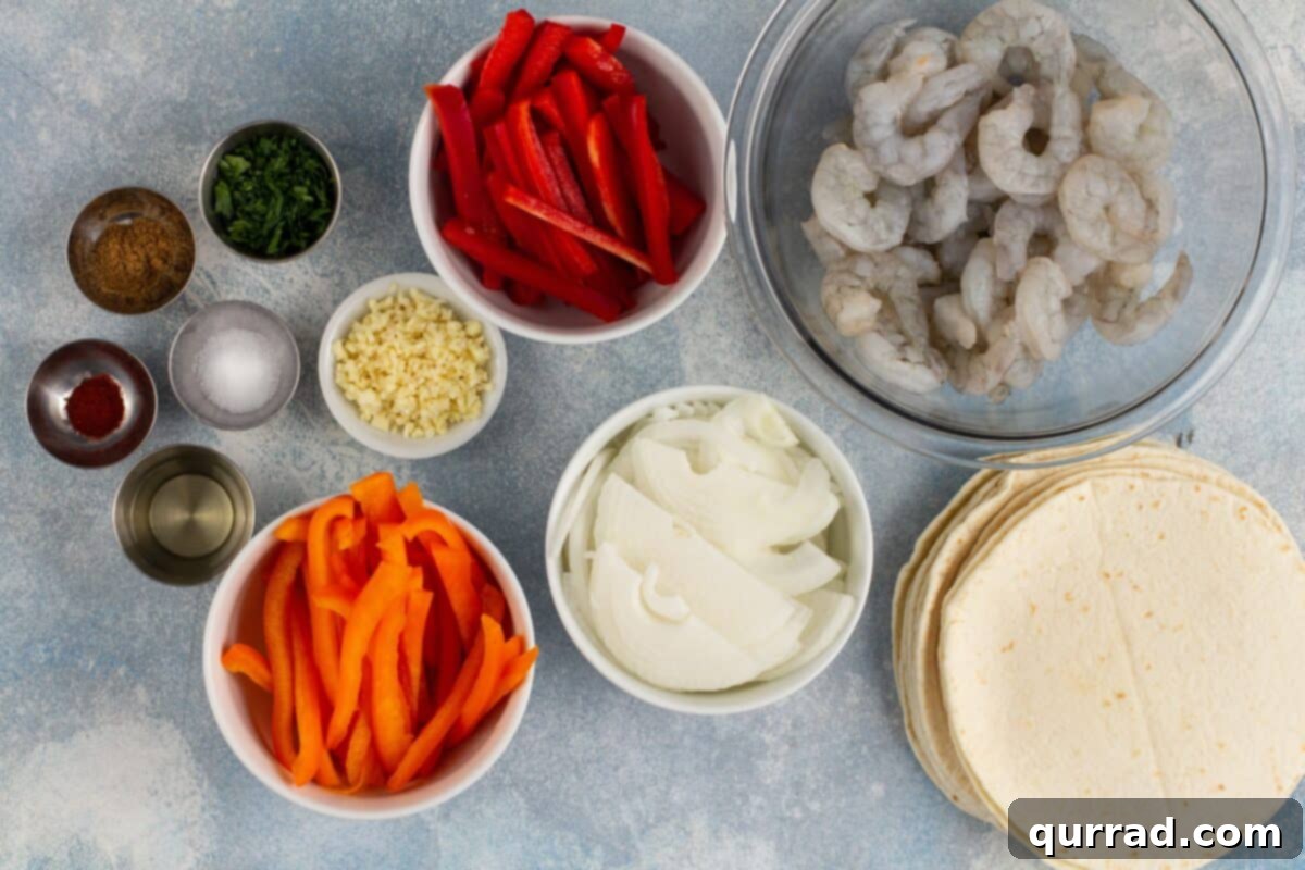 Sizzling Shrimp Fajitas 4 All ingredients laid out for making shrimp fajitas, including fresh shrimp, bell peppers, onion, and spices.