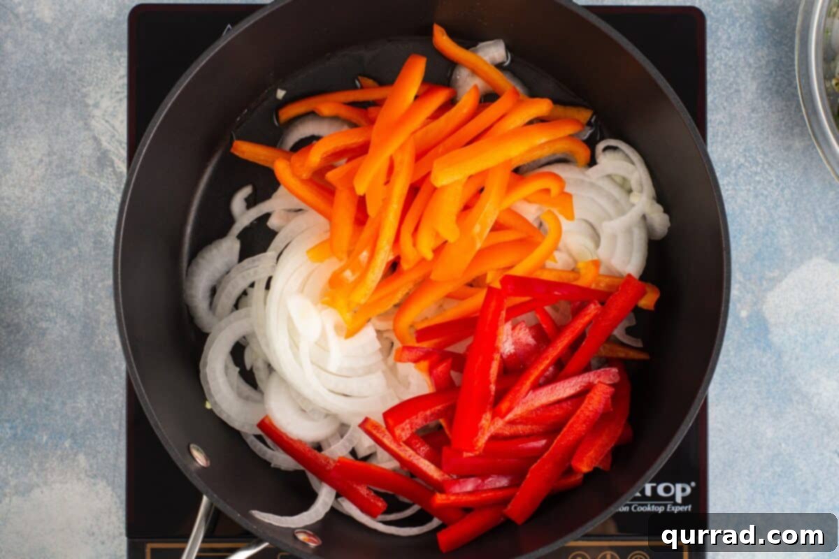 Sizzling Shrimp Fajitas 6 Sliced bell peppers and onions sizzling in a hot nonstick skillet, beginning to char.