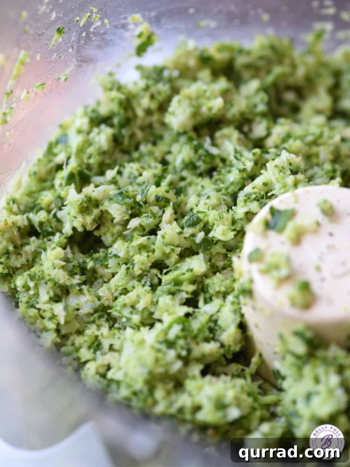 Emerald Broccoli Pesto Spaghetti 3 Close-up of a bowl filled with smooth, bright green pureed broccoli, the base for the delicious pesto.