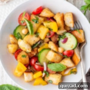overhead Panzanella salad in bowl with fork