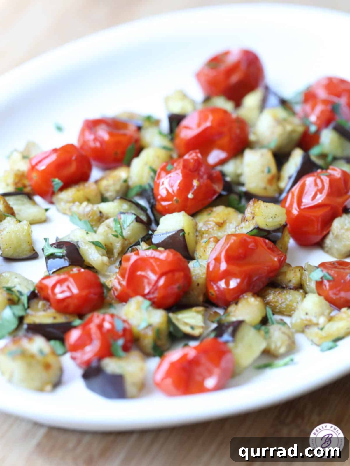 Savory Roasted Eggplant and Sweet Cherry Tomatoes 4 serving tray featuring a vibrant mix of cooked diced eggplant and roasted cherry tomatoes, ready to be enjoyed