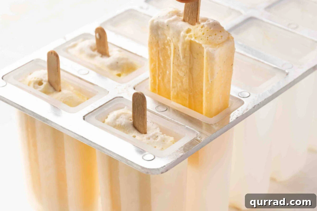 Citrus Cream Dream 7 Removing a perfectly frozen orange creamsicle from its mold.