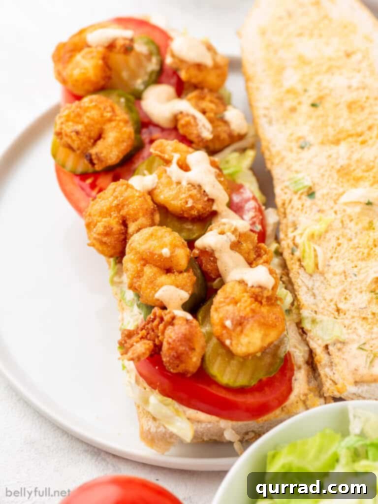 Crispy Shrimp Po Boy 3 shrimp po boy sandwich with remoulade sauce on a rustic serving tray