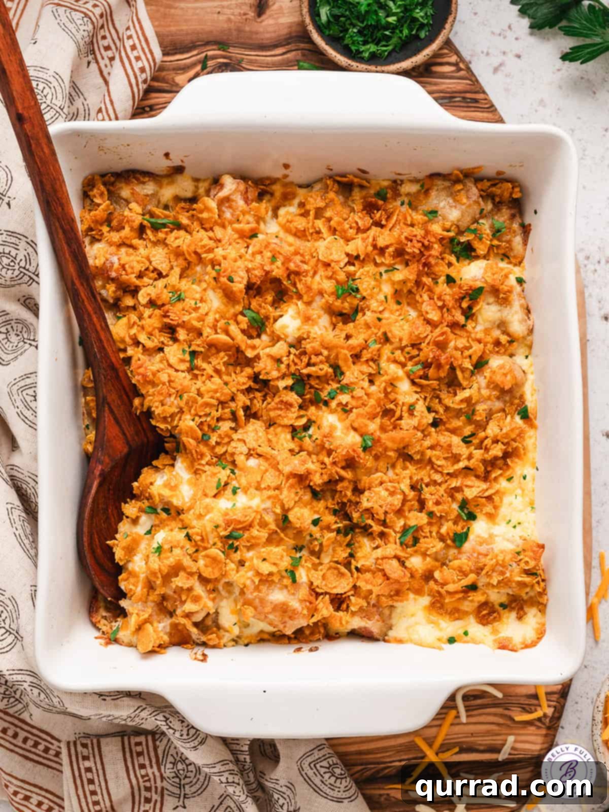 overhead casserole of cheesy funeral potatoes, golden brown and bubbly