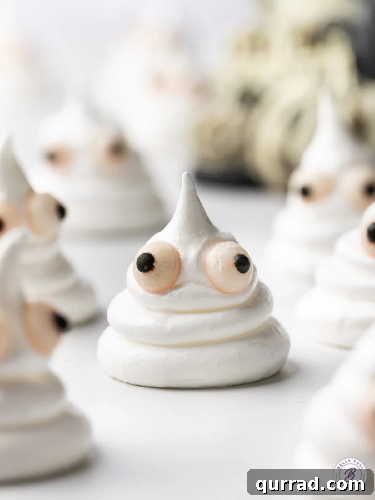 Spectral Meringue Kisses 3 close up Halloween Ghost Meringue Cookie with candy eyes