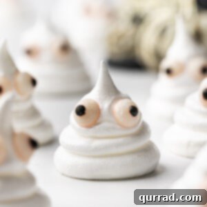 Spectral Meringue Kisses 6 close up Halloween Ghost Meringue Cookie with candy eyes