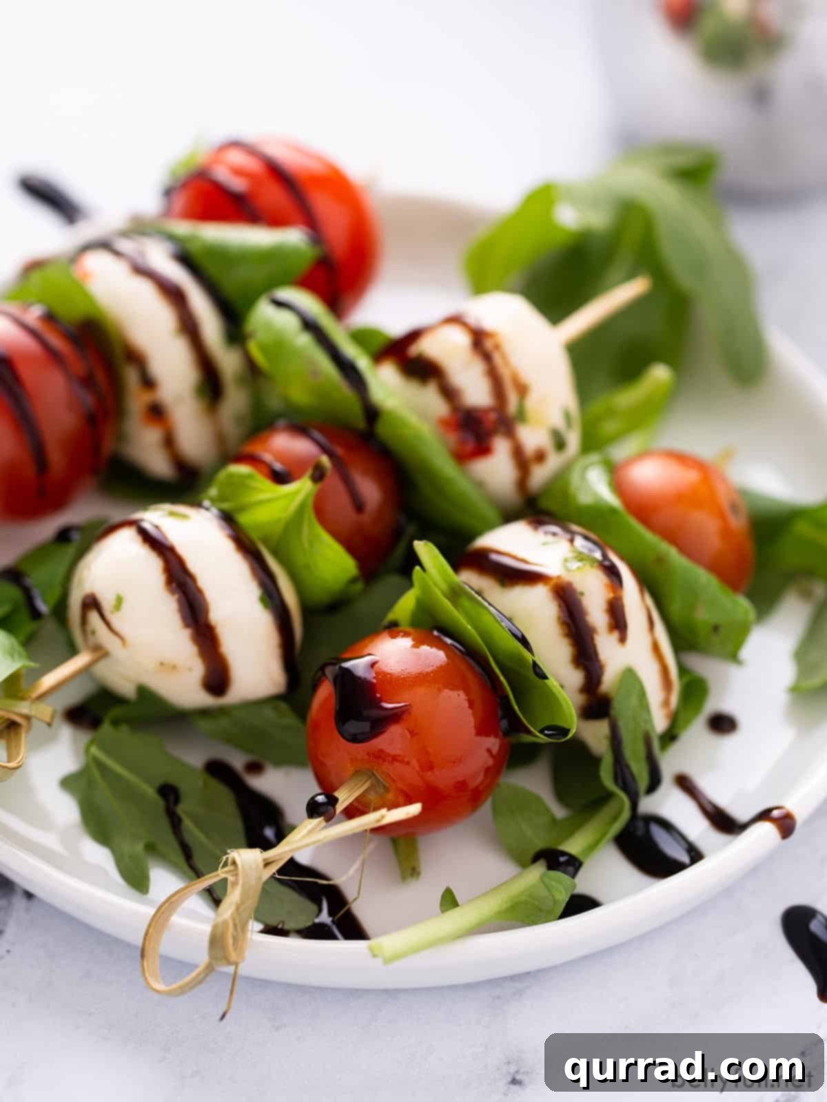 close up caprese skewer appetizer with balsamic glaze