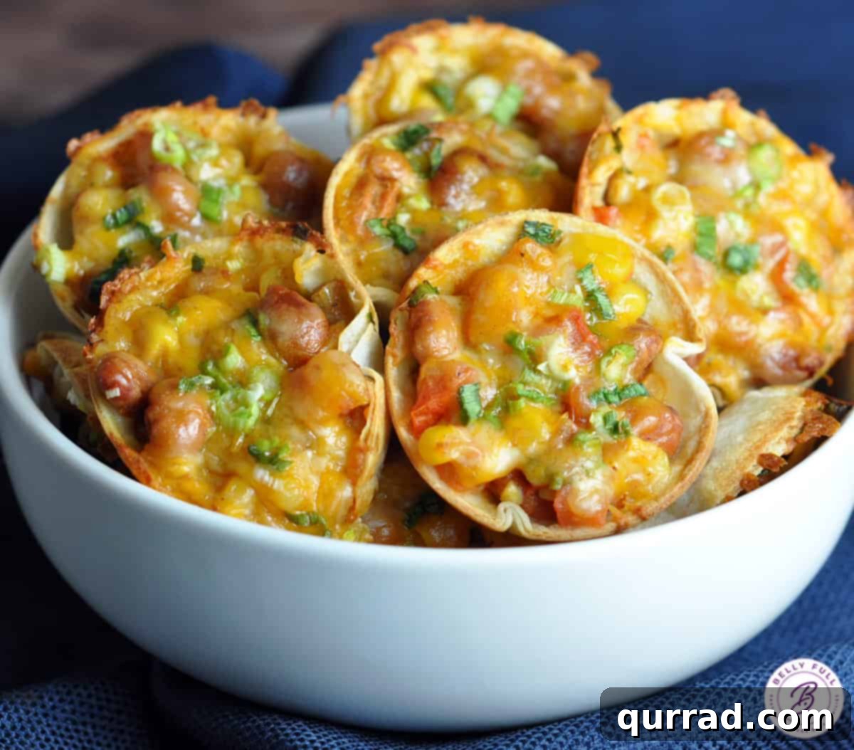 A vibrant bowl of the Southwestern Saucers filling, showcasing the colorful mix of beans, corn, diced tomatoes, and green onions