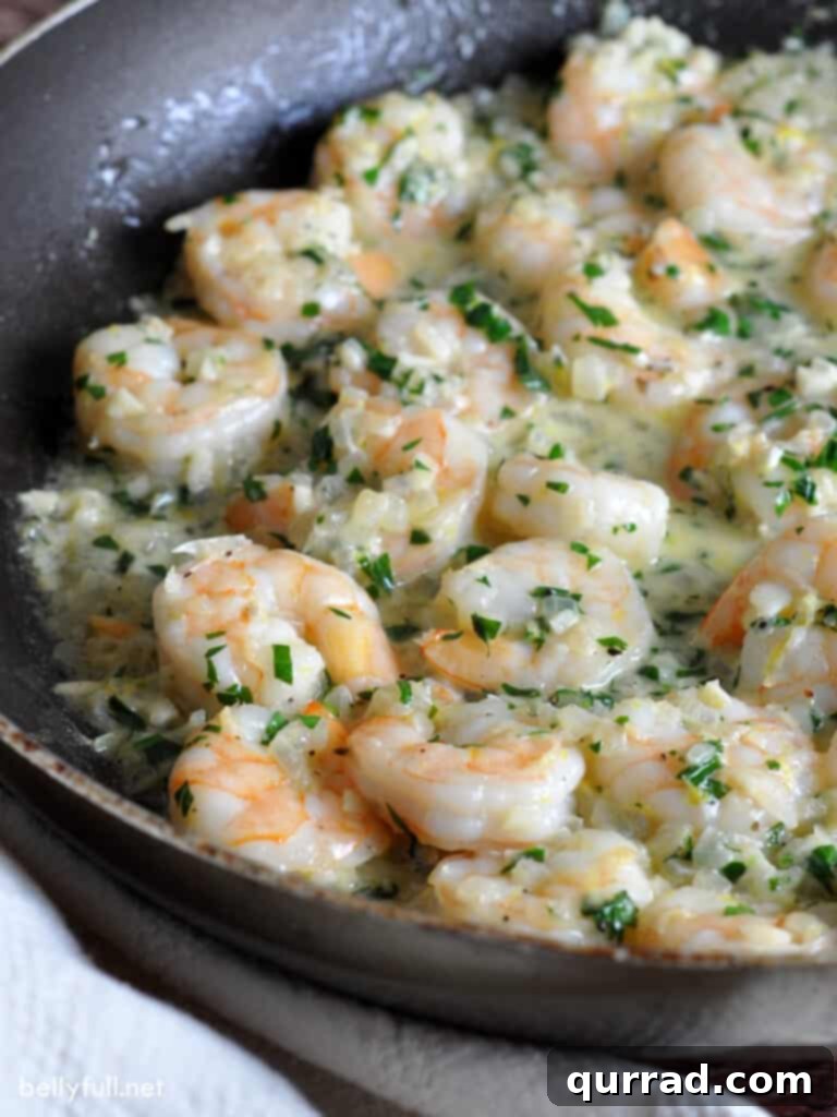 shrimp scampi in skillet with butter sauce