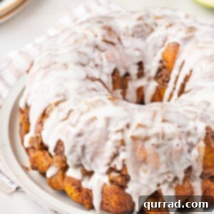 Gooey Caramel Apple Monkey Bread 6 iced monkey bread on white plate