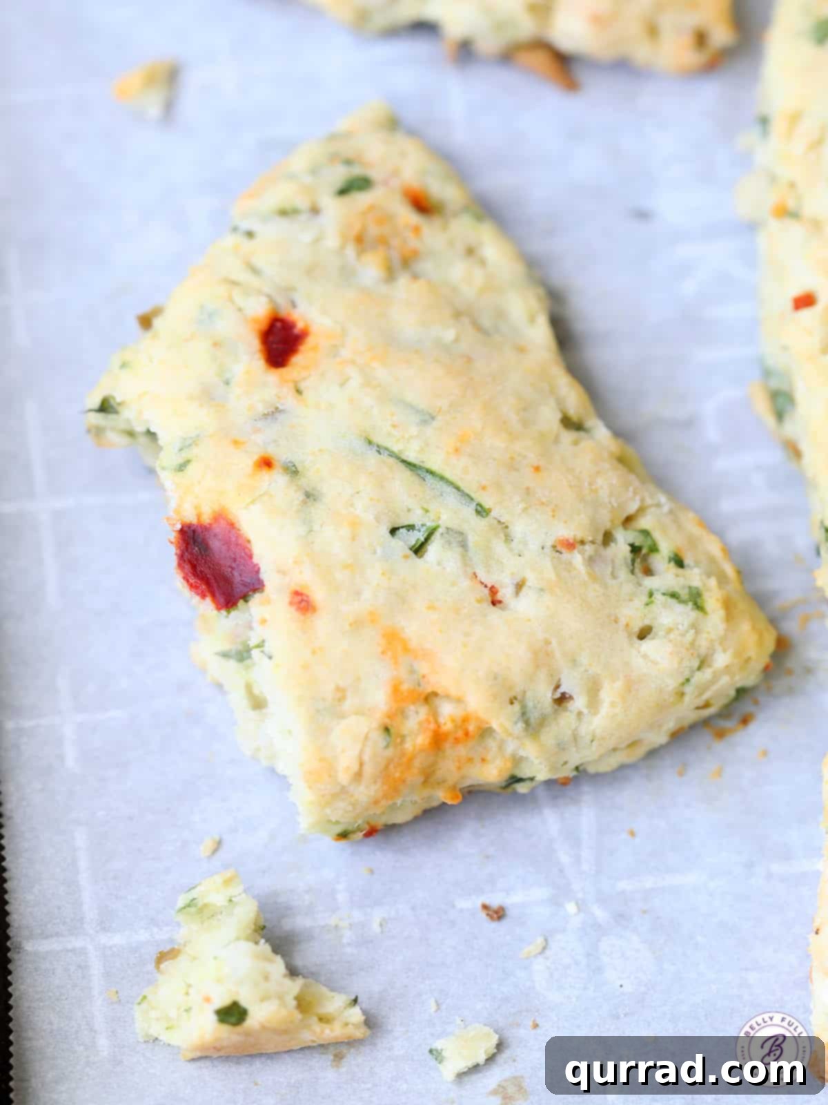 Bruschetta Scone split in half, revealing the savory ingredients inside.