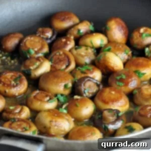 whole sautéed mushrooms in skillet, recipe card image