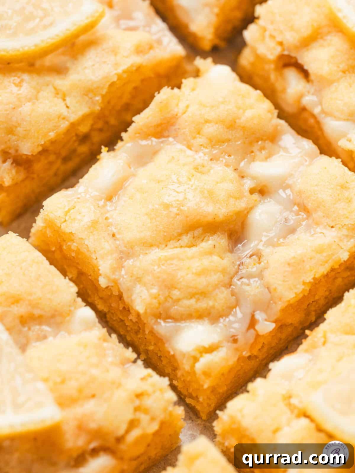 Zesty Lemon Bliss Bars 2 close up lemon gooey bar, showcasing its moist, chewy, and amazing texture