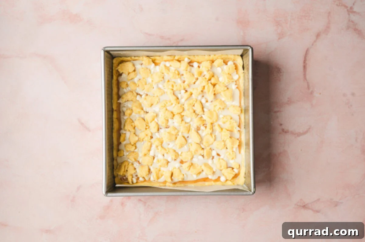 Zesty Lemon Bliss Bars 8 unbaked lemon bars in square baking dish with crumbled dough topping