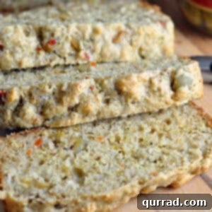 Mediterranean Olive Loaf 5 sliced olive bread on cutting board