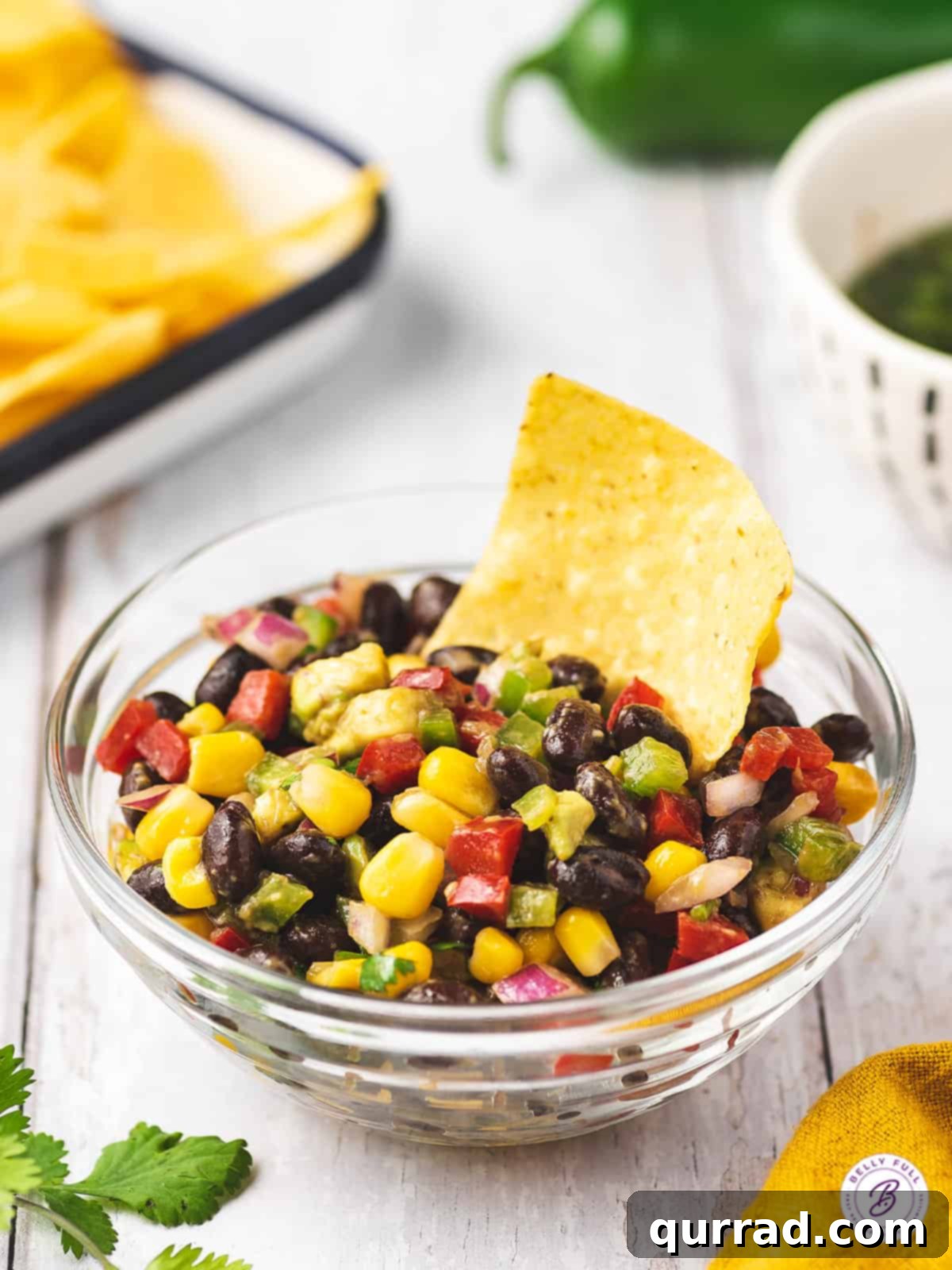 Fiesta Black Bean Corn Salsa 5 Black Bean and Corn Salsa in a glass bowl with tortilla chip