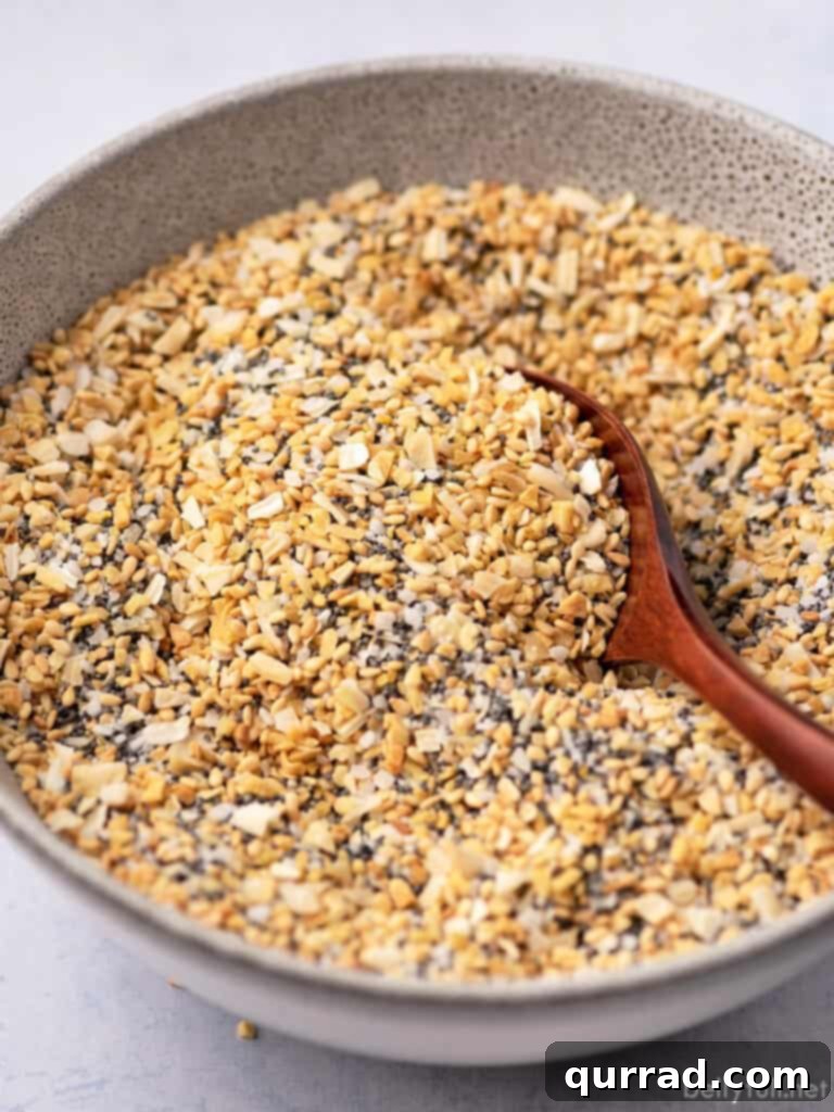 Everything Seasoning Blend 2 bowl of everything bagel seasoning with tiny wooden spoon