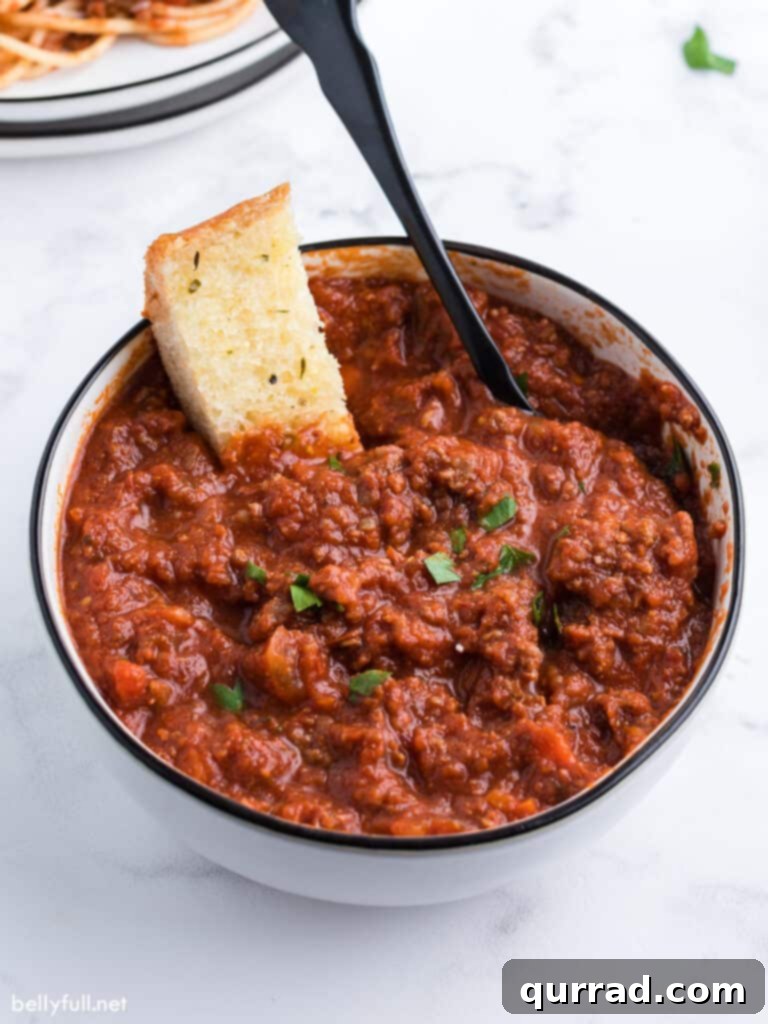 Bolognese Sauce 2 Bolognese sauce in bowl with slice of garlic bread