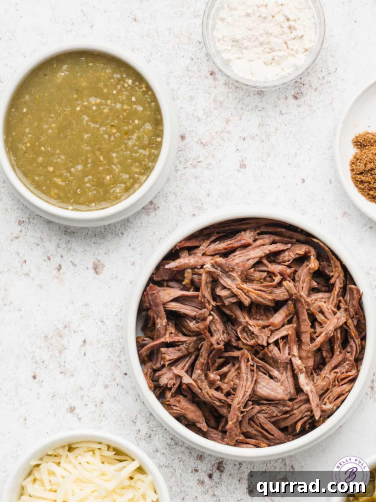 Bowls filled with vibrant salsa verde and tender shredded beef, ready for taco assembly.