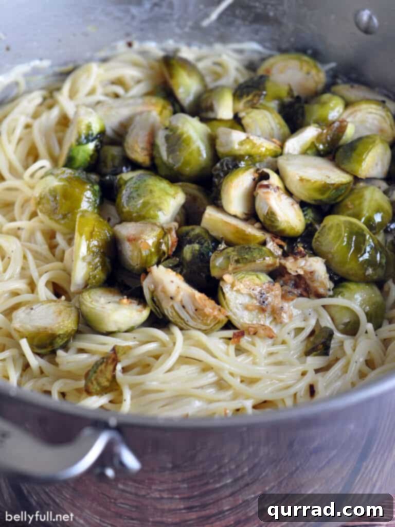 cooked pasta and roasted brussels sprouts in pot