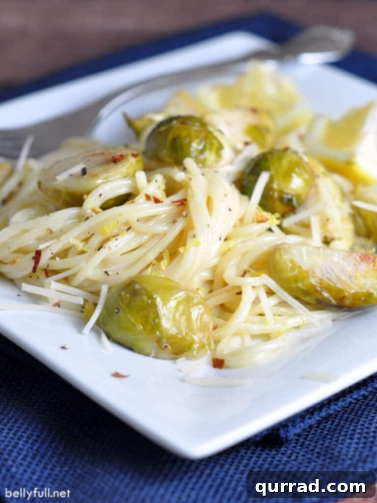 creamy pasta with brussels sprouts on plate with fork