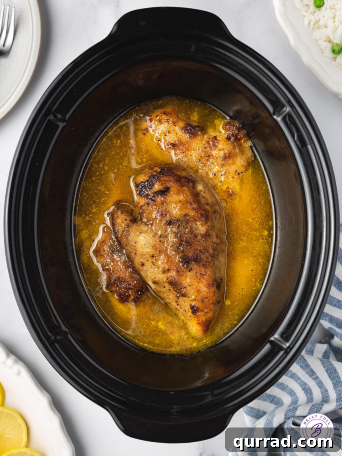 overhead whole chicken breasts in lemon broth in crockpot