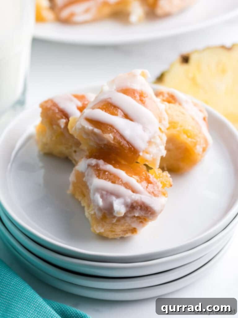 Island Escape Monkey Bread 3 pieces of glazed dough bites on white plate