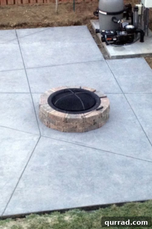 Newly built DIY fire pit in a backyard, ready for s'mores
