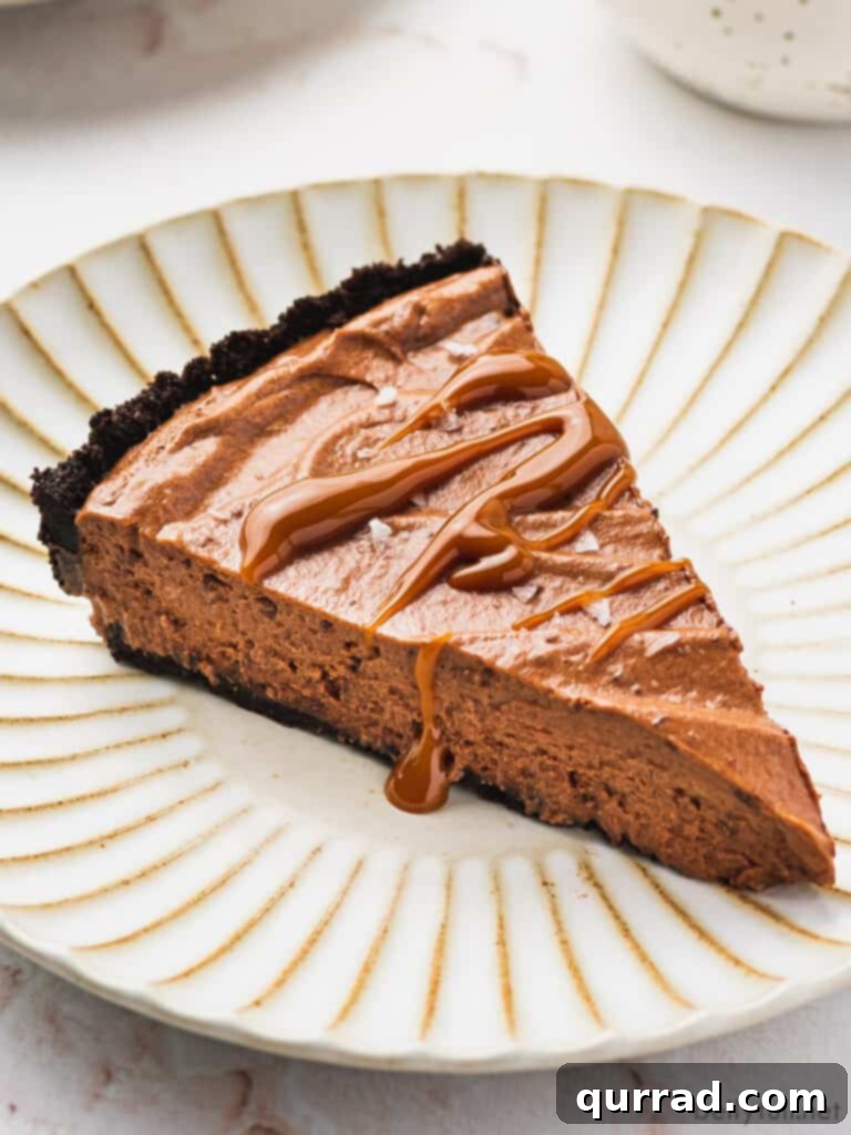 Decadent Chocolate Dream Pie 2 slice of chocolate mousse pie drizzled with caramel on ornate plate