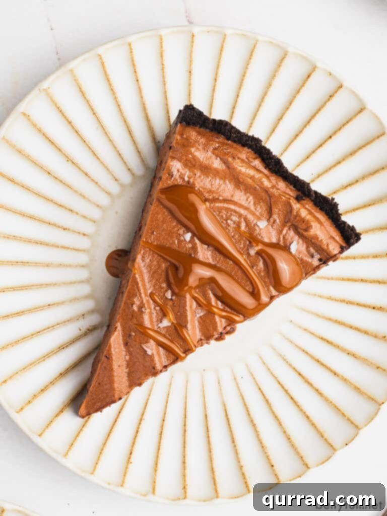Decadent Chocolate Dream Pie 5 overhead slice of chocolate mousse pie drizzled with caramel on ornate plate