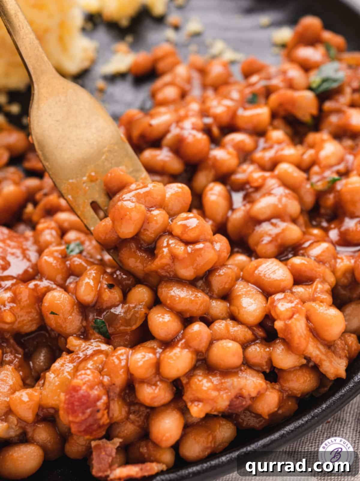 Grandma's Secret Baked Beans 8 Forkful of baked beans.