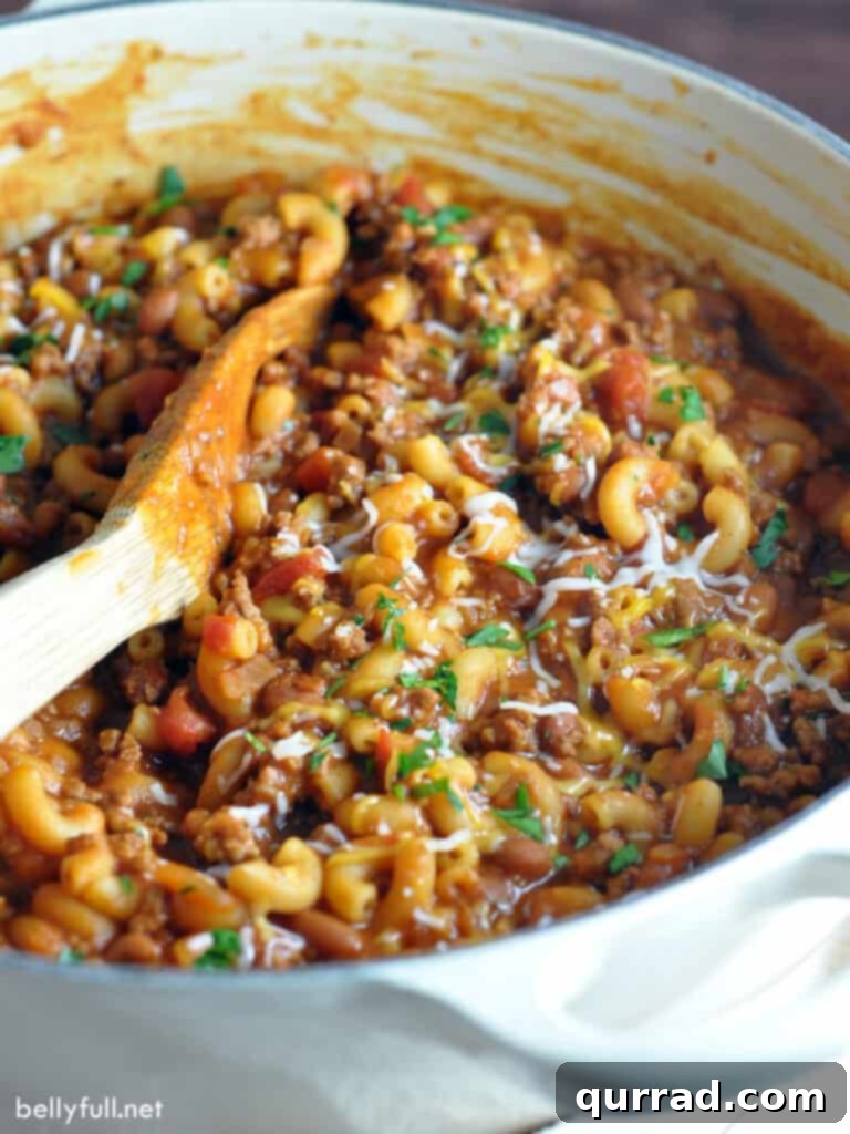 pot of chili mac with wooden spoon