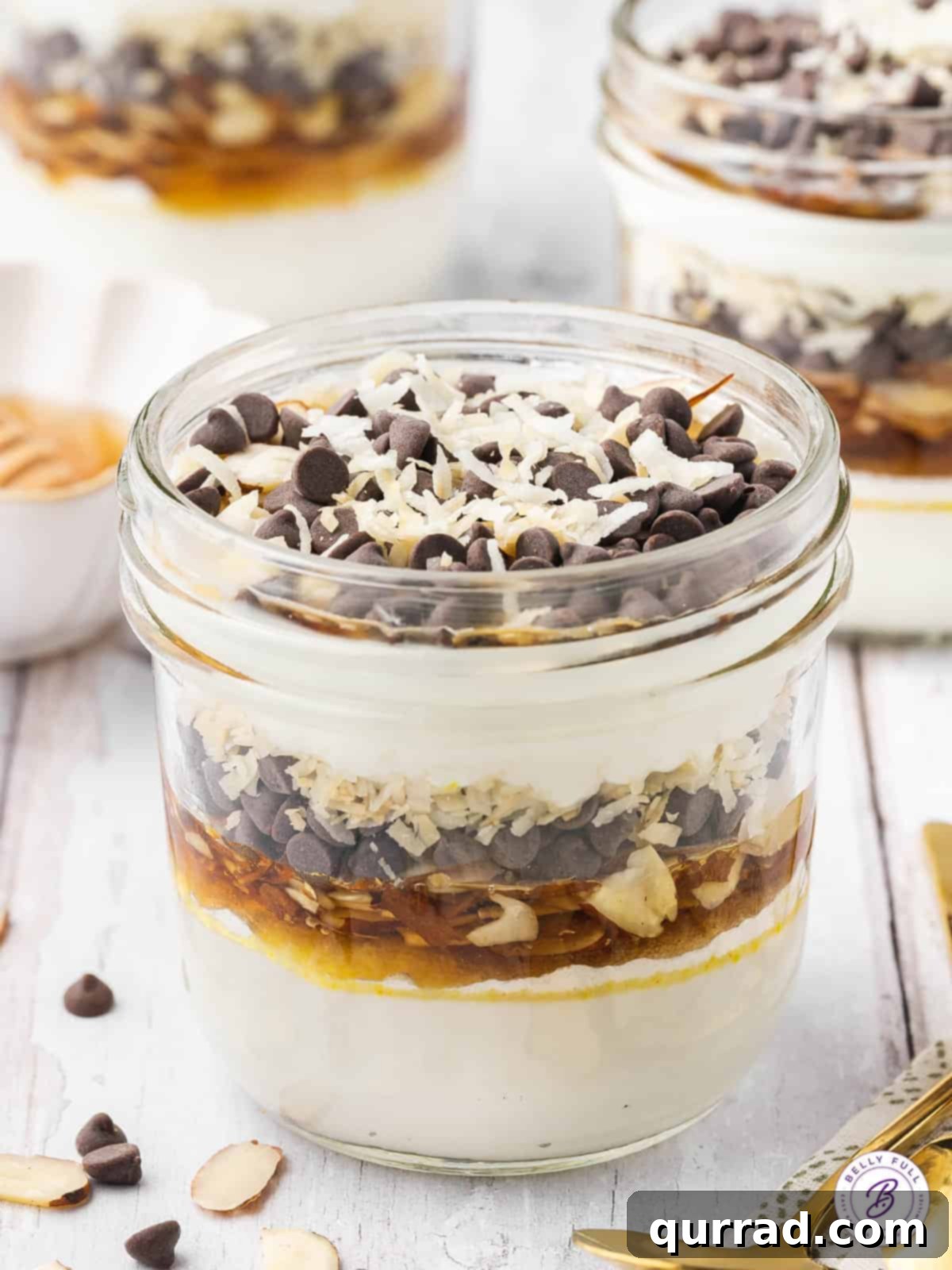 Creamy Coconut Almond Parfait Dream 3 jar of a layered almond joy yogurt parfait