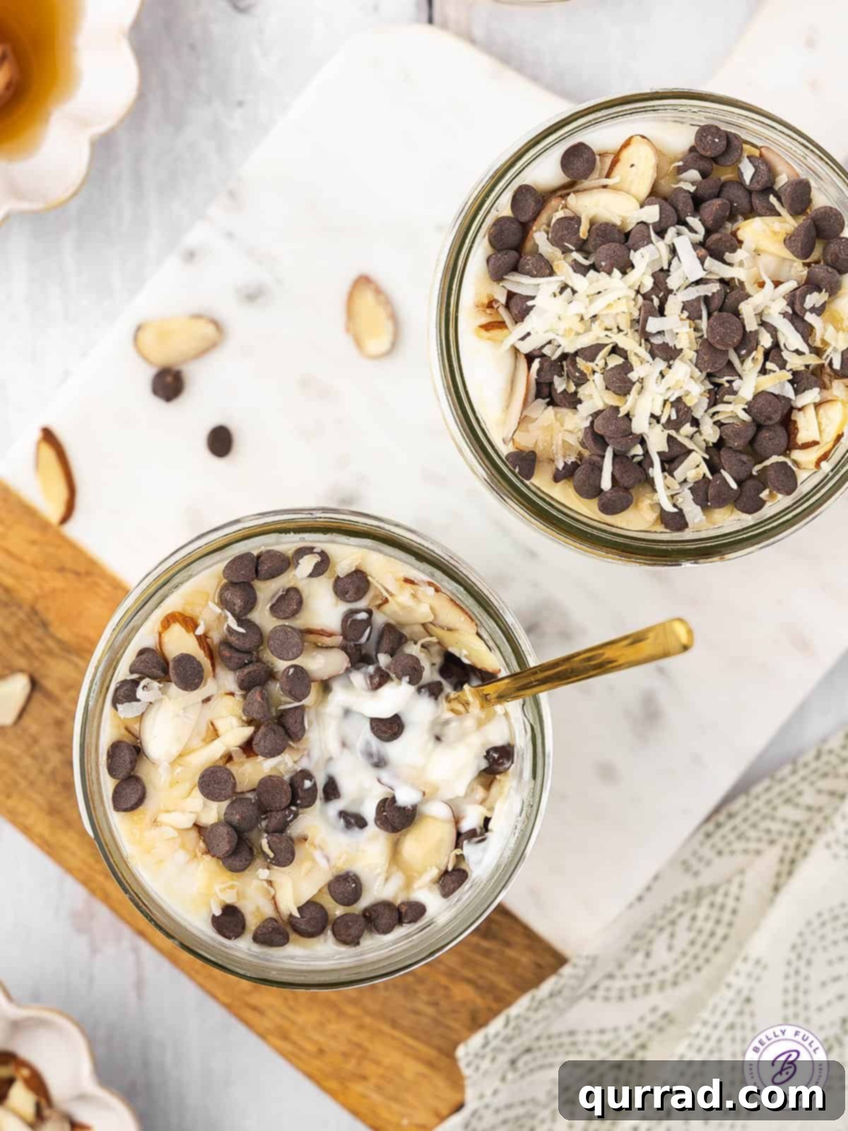 Creamy Coconut Almond Parfait Dream 4 2 jars overhead filled with yogurt, coconut, and chocolate chips