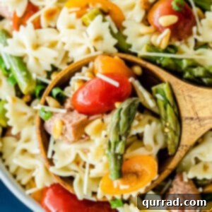 A portion of Italian Pasta Salad being served on a wooden spoon