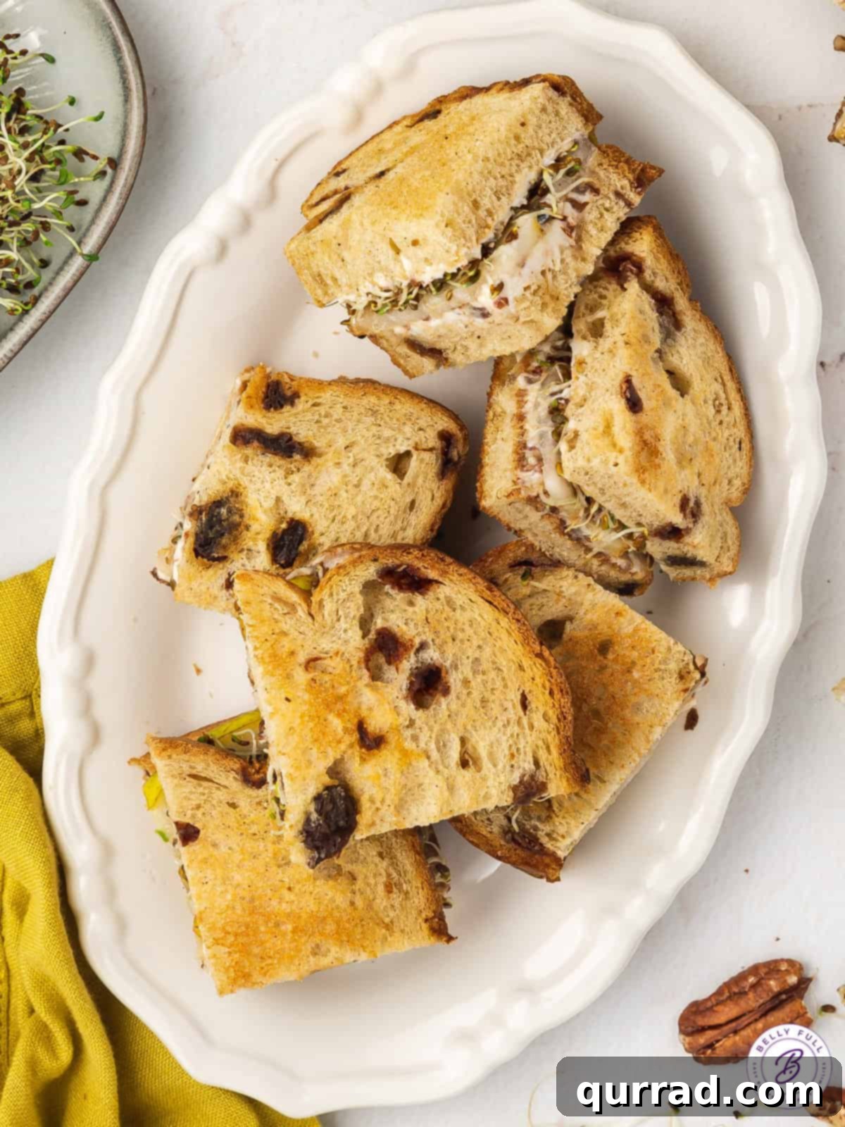 Delicate Pear Tea Bites 3 pear sandwich with cinnamon-raisin bread cut into squares