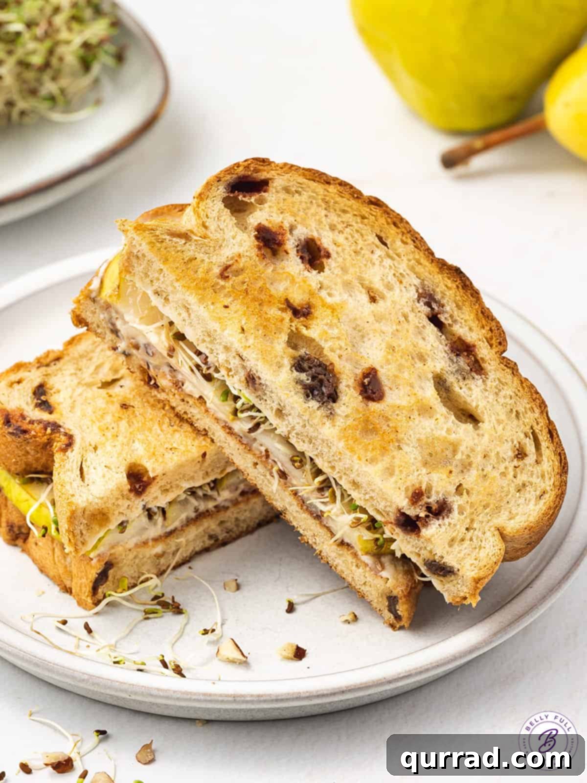 Delicate Pear Tea Bites 4 cinnamon-bread pear sandwich sliced in half